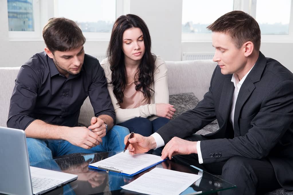 Couple Signing Contract